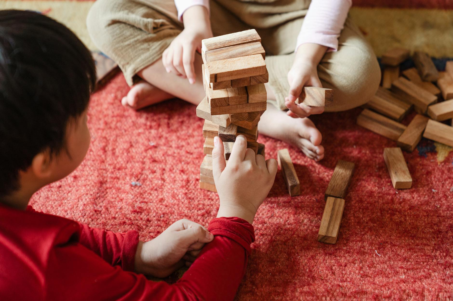 children playing jenga